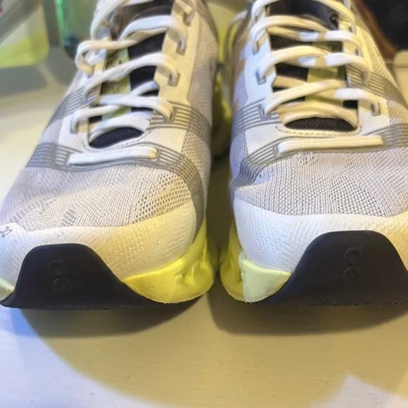 On Running Light Gray and Soft Yellow Shoes